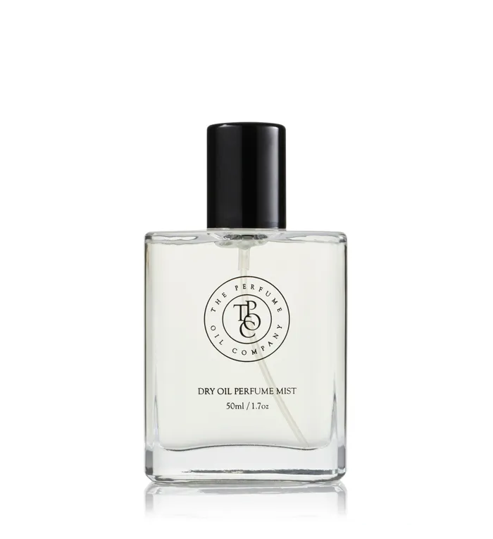 Square perfume bottle with a black cap on a white background