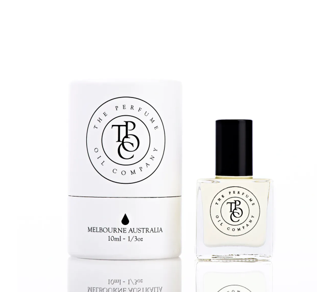 Roll-on perfume oil bottle and white gift tube, front view on white