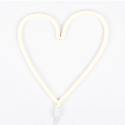 Heart neon LED light mounted on a bedroom wall