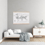 A wanderlusting soul's room, adorned with a bed and a wall hanging of Let's See It All, a world map by AXEL & ASH.