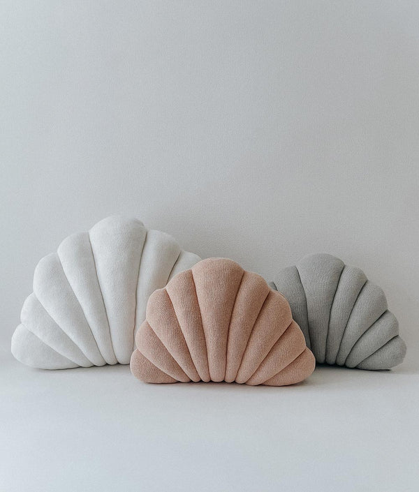 Three SMALL SHELL CUSHION - MIST / NOUGAT cushions from Bengali Collections on a white surface.