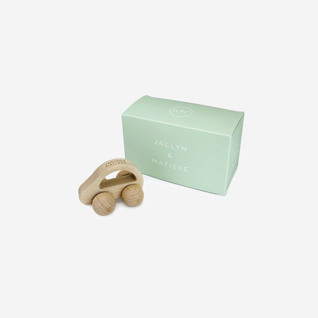 Carter the Car beside its mint green gift box, on white
