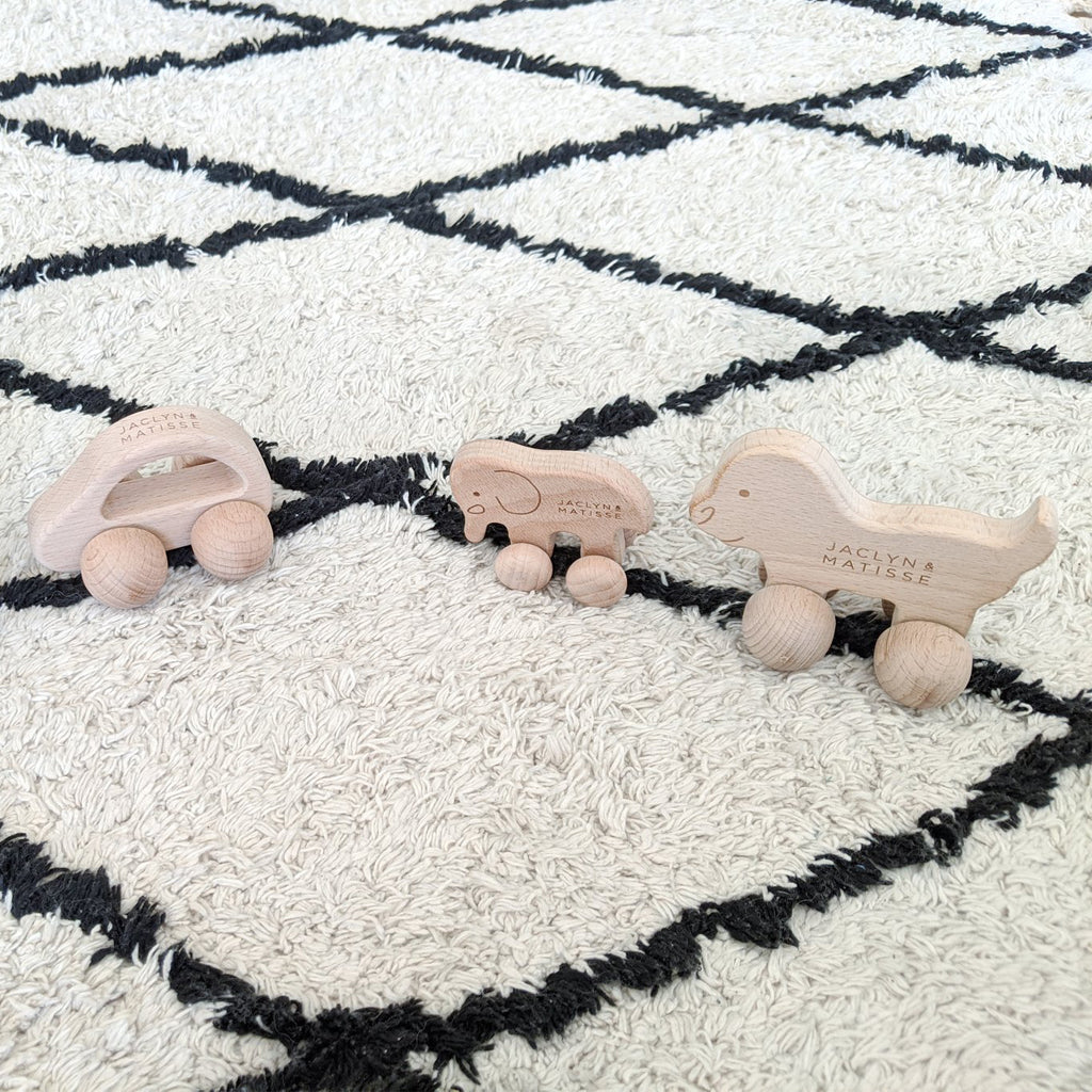 Carter cars in natural and pink on a black and white diamond rug