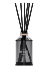 The Aromatherapy Co's Smith & Co Diffuser - Fig & Ginger Lily with black sticks, perfect for creating a refreshing summertime ambiance.