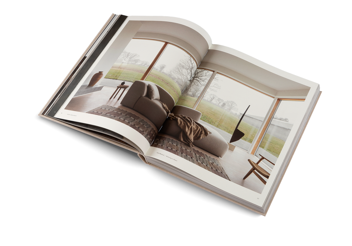 Soft Minimal open at a photo spread of a living room with a sofa and large garden windows