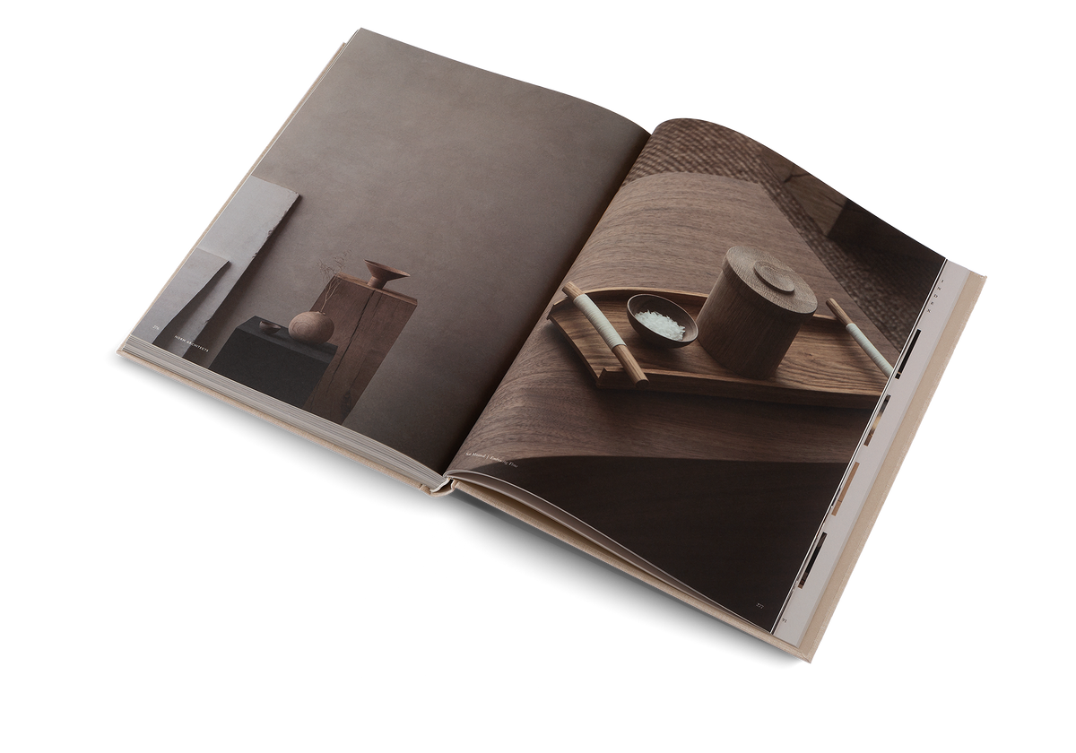 Soft Minimal open at a dim photograph of figures and objects facing a dark timber living space