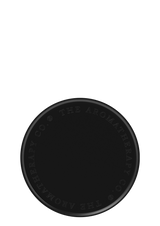 A matte black circular plate with the word 'aroma' written on it, designed to protect surfaces and serve as The Aromatherapy Co's stylish Candle & Diffuser Plate.