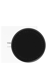 A matte black card with The Aromatherapy Co logo on it, designed to protect surfaces as a Candle & Diffuser Plate.