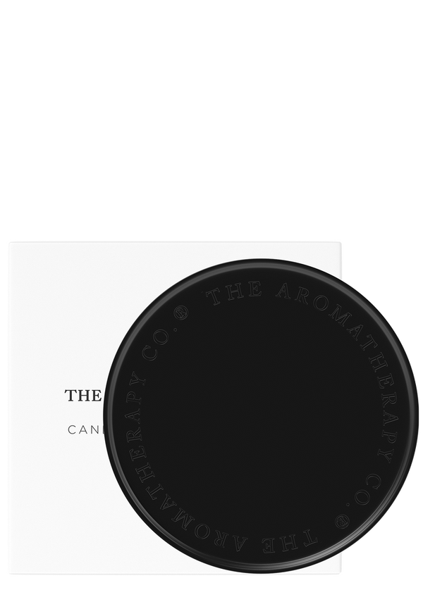 A matte black card with The Aromatherapy Co logo on it, designed to protect surfaces as a Candle & Diffuser Plate.