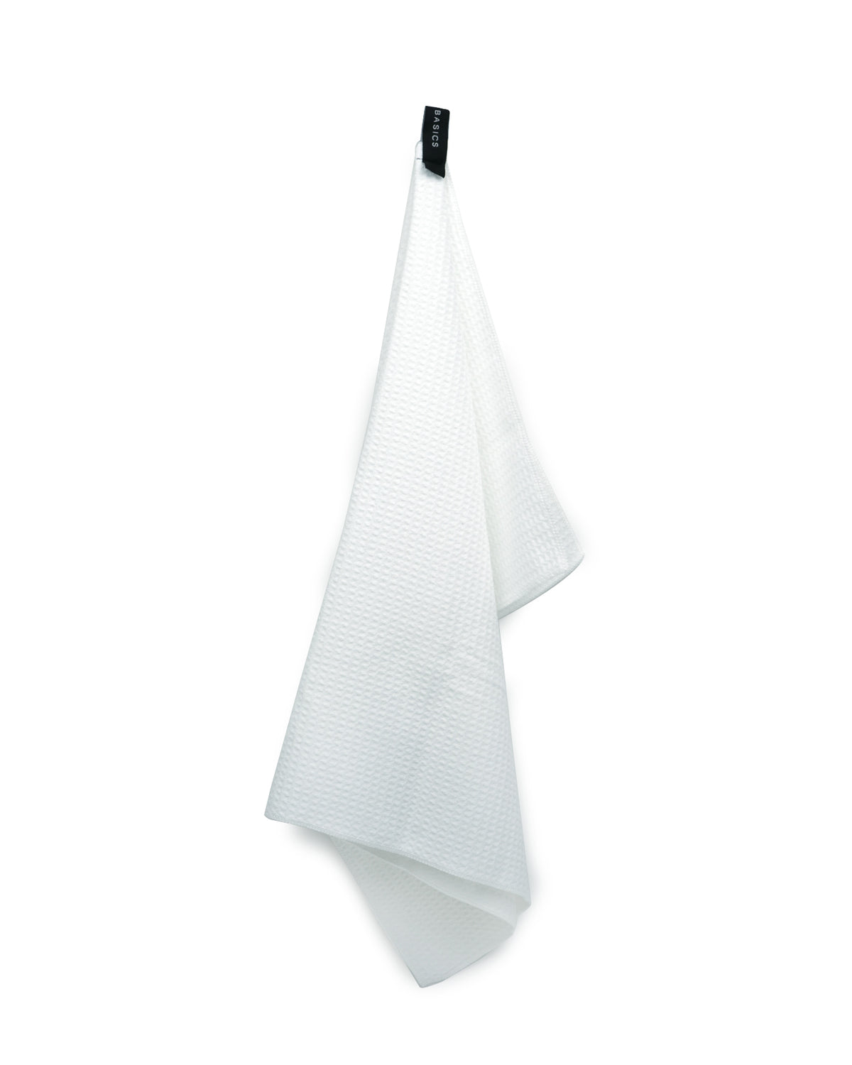 White waffle microfibre tea towel hanging loosely, showing the woven texture