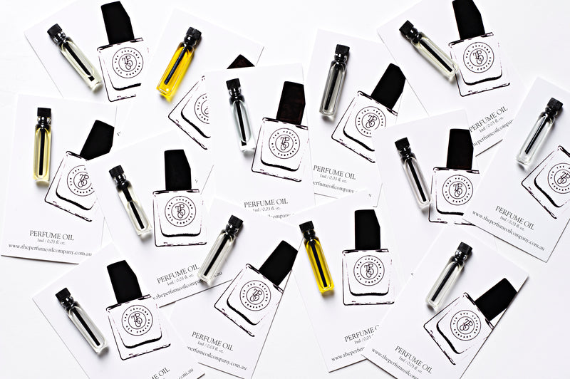 A collection of business cards with a DAISY perfume bottle motif, inspired by Daisy (M Jacobs), from The Perfume Oil Company.