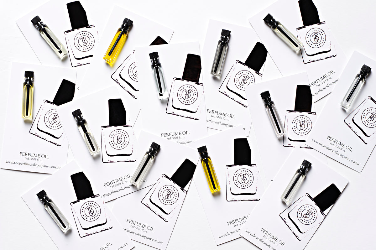 Flat lay of The Perfume Oil Company sample vials and roll-on bottles