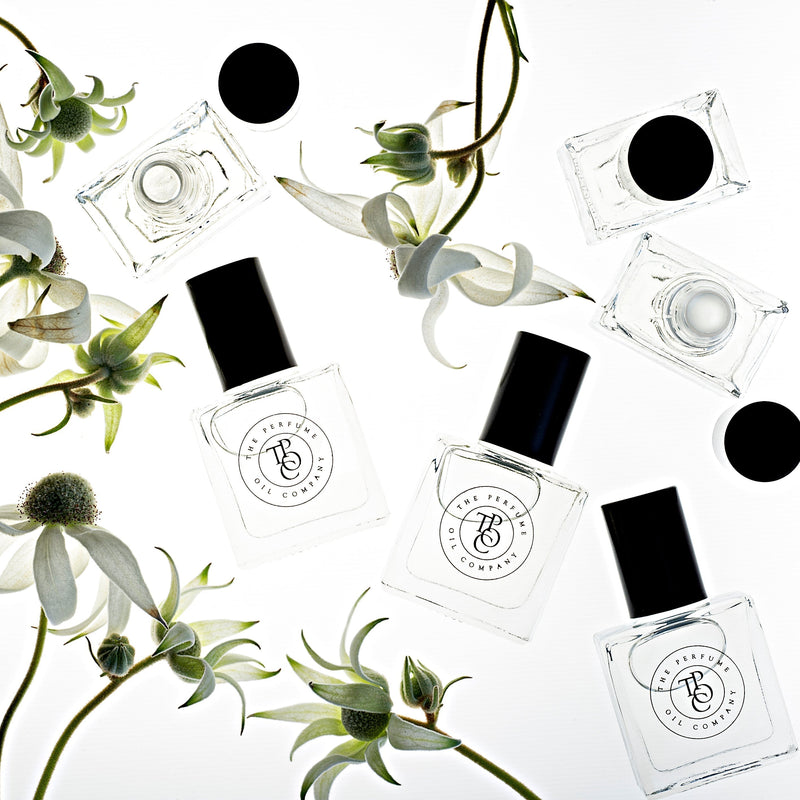 A collection of TULIP, inspired by La Tulipe (Byredo) bottles with flowers on them from The Perfume Oil Company.
