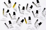 A set of TULIP business cards with a bottle of perfume inspired by La Tulipe (Byredo) from The Perfume Oil Company.