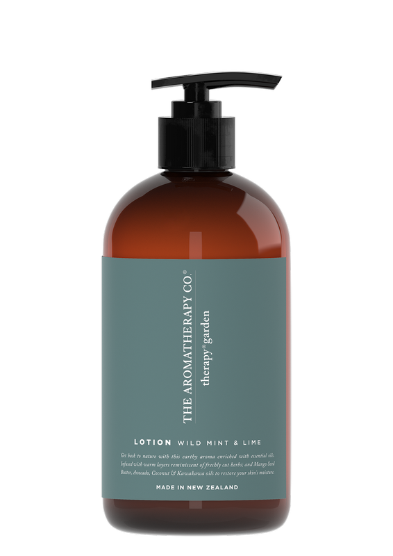 A bottle of Therapy® Garden Hand & Body Lotion - Wild Lime & Mint with a black bottle featuring Kawakawa oil on a gray background. (Brand: The Aromatherapy Co)