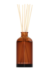 Invigorating Therapy® Diffuser Uplift - Sweet Lime & Mandarin in a brown bottle with sticks from The Aromatherapy Co.