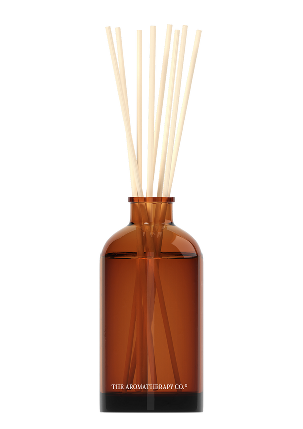 Invigorating Therapy® Diffuser Uplift - Sweet Lime & Mandarin in a brown bottle with sticks from The Aromatherapy Co.