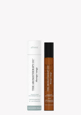 A bottle of Therapy® Pulse Point Stress - Peppermint & Lavender hair oil next to a tube.