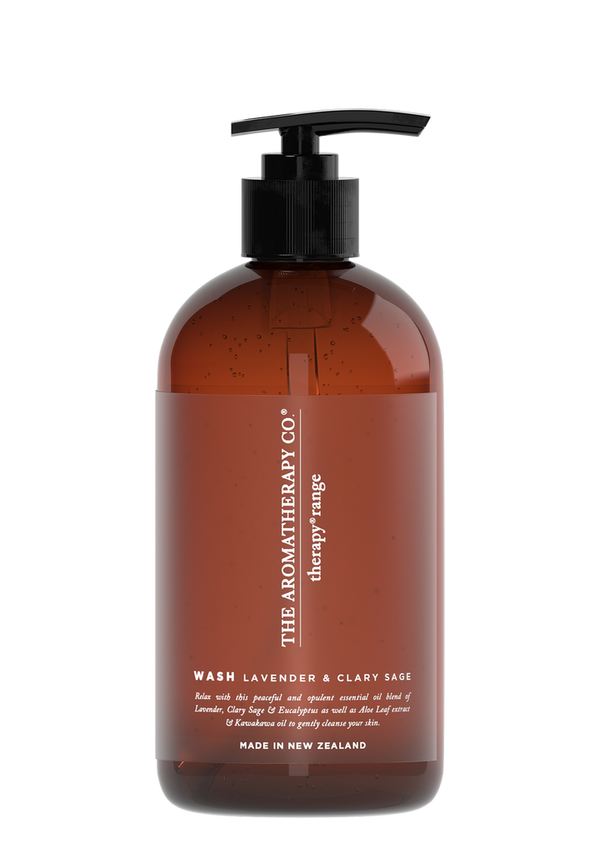 A bottle of Therapy® Hand & Body Wash - Lavender & Clary Sage by The Aromatherapy Co with a brown bottle on a black background.