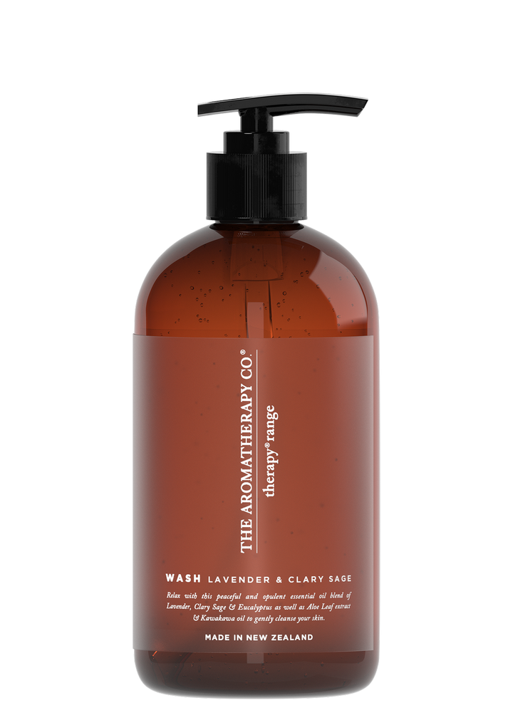 A bottle of Therapy® Hand & Body Wash - Lavender & Clary Sage by The Aromatherapy Co with a brown bottle on a black background.