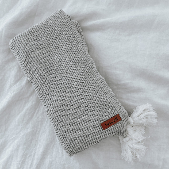 A Ribbed Tassel Throw | Grey made by Bengali Collections with a white tassel is made of Oeko-tex® certified cotton.