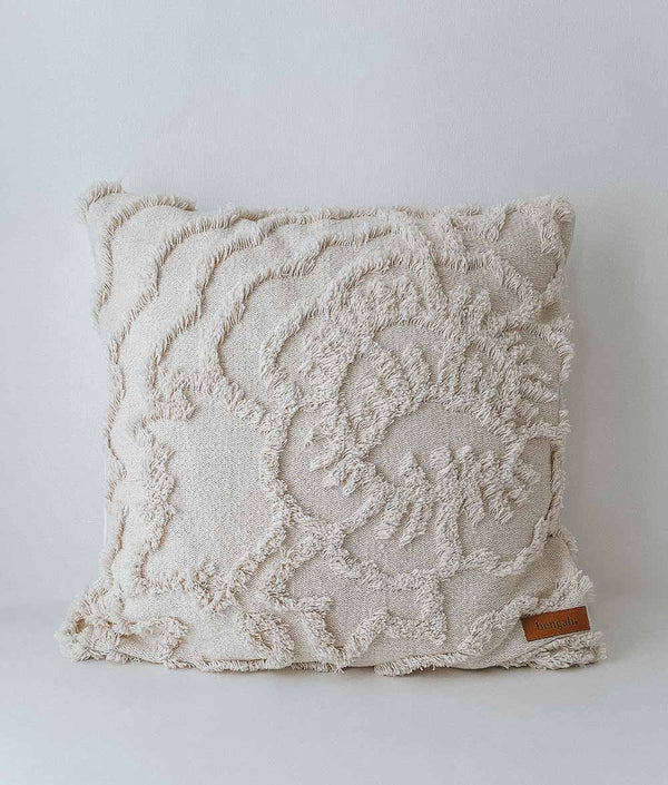 An Ivory Tufted Cushion Cover with a crocheted pattern by Bengali Collections.