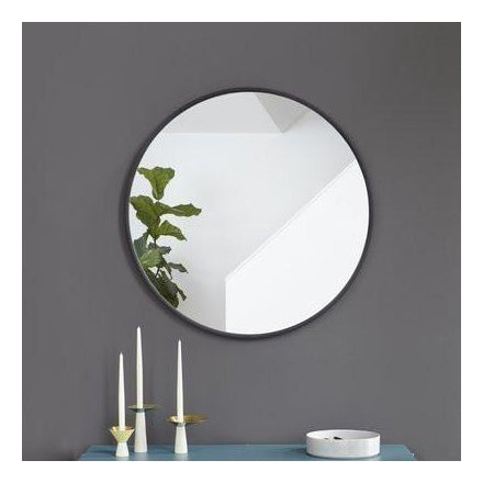 Umbra Hub 60cm round mirror mounted above a console table