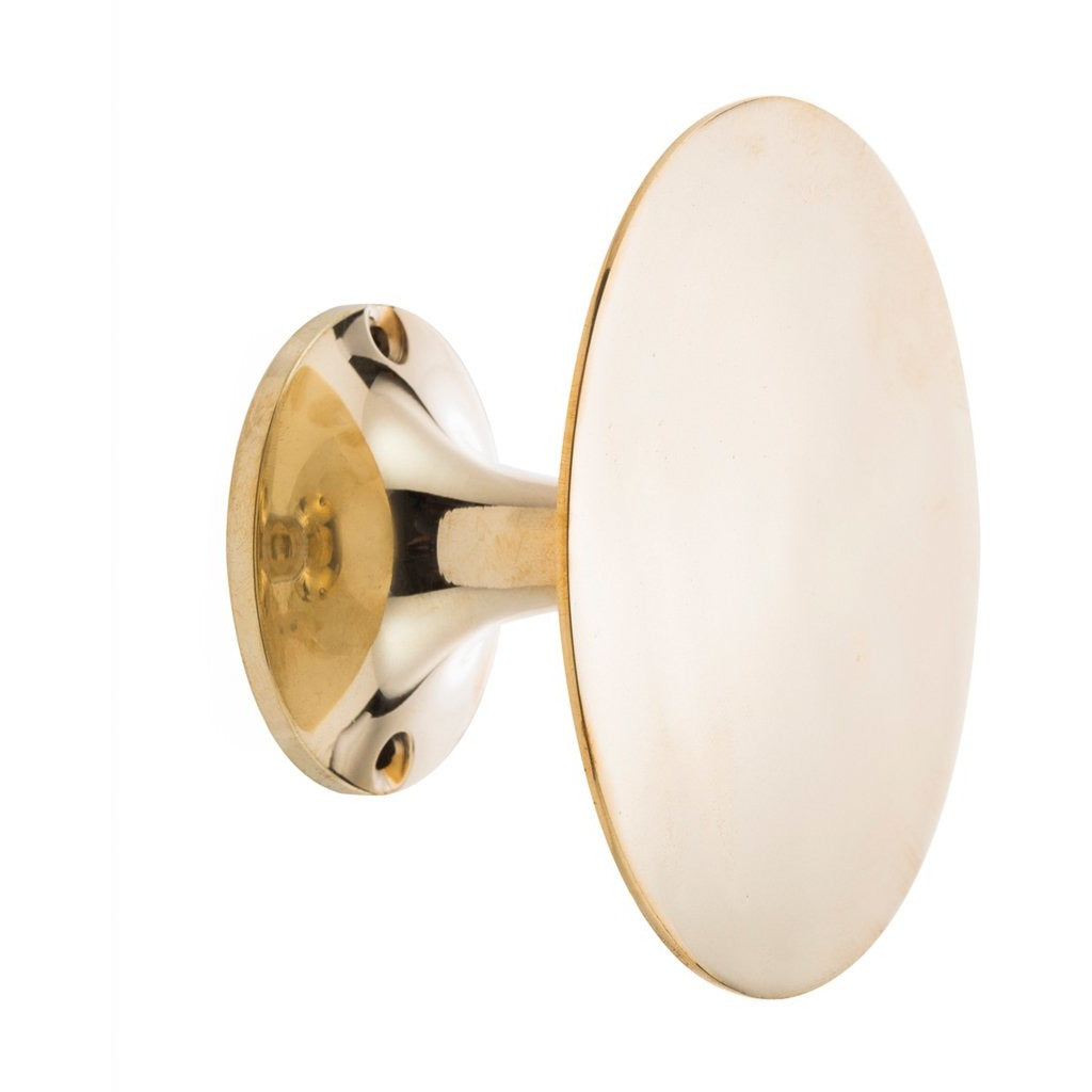 Zakkia large brass button wall hook with a flat round face