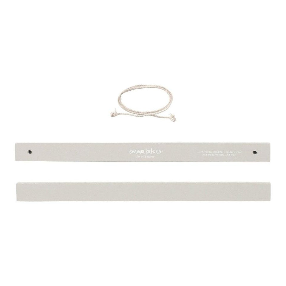 Close up of Emma Kate Co magnetic art hanger hardware and string