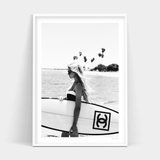 A black and white photo of a woman holding a surfboard, available for Surfer Chic prints with delivery from Art Prints.