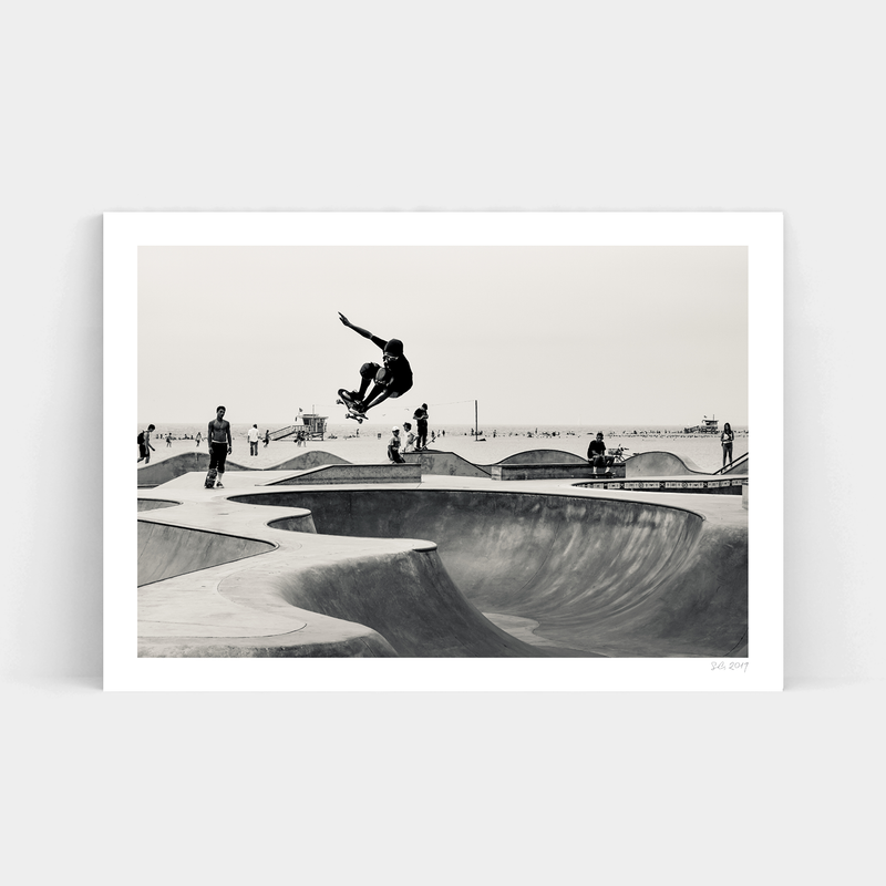 A skateboarder performing tricks at Oceanfront Park, captured in a striking black and white photo by Art Prints.
