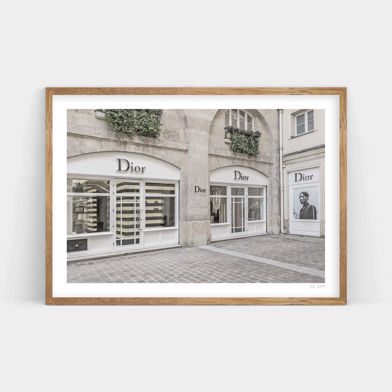 A black and white photo of a Dior Art Prints storefront in Paris available for prints.