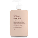 A bottle of We Are Feel Good Inc. Coco Milk Coconut Moisturiser, a coconut moisturizer, on a white background.
