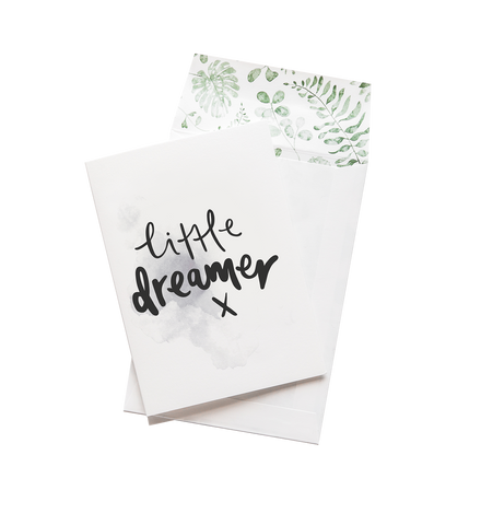 A greeting card featuring the words "little dreamer" by Emma Kate Co.