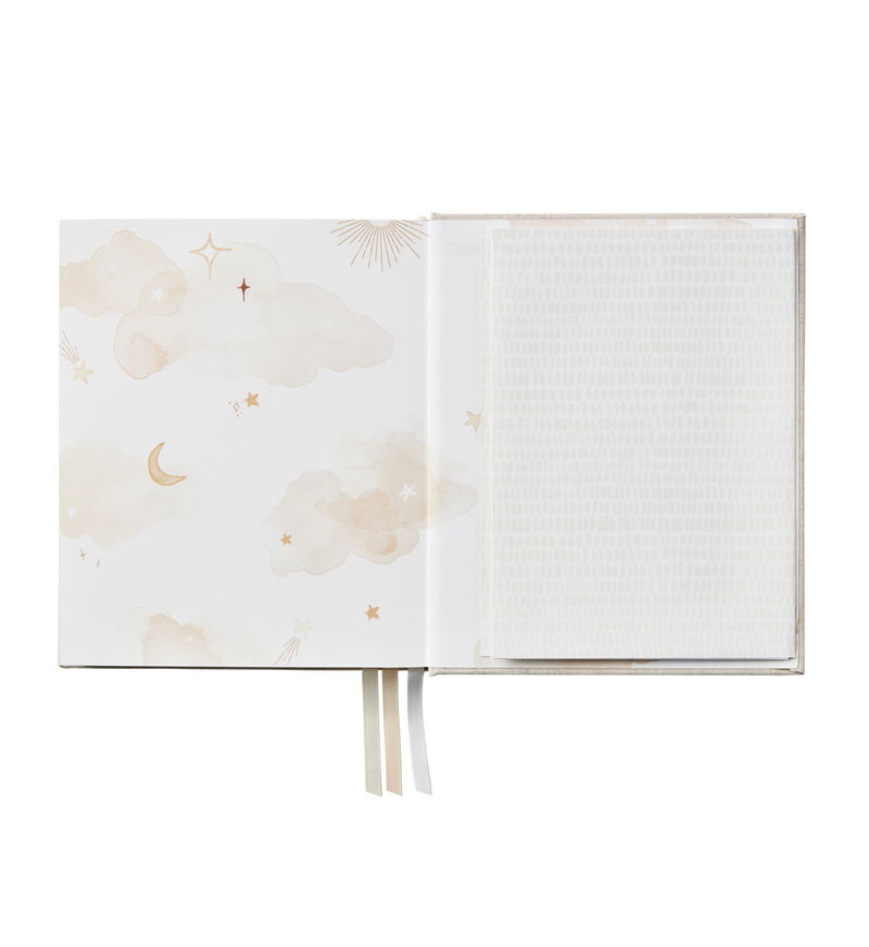 A Little Dreamer baby journal with moon and stars designs, perfect for nursery or baby shower gifting.
