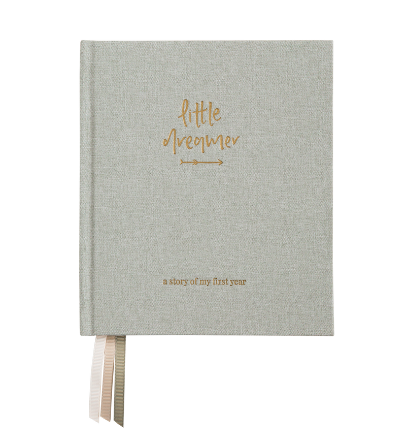 A Sage Green nursery baby journal with a gold ribbon on it by Emma Kate Co.