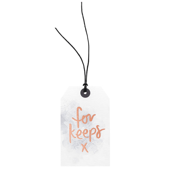 A For Keeps gift tag attached with European hemp twine, made by Emma Kate Co.