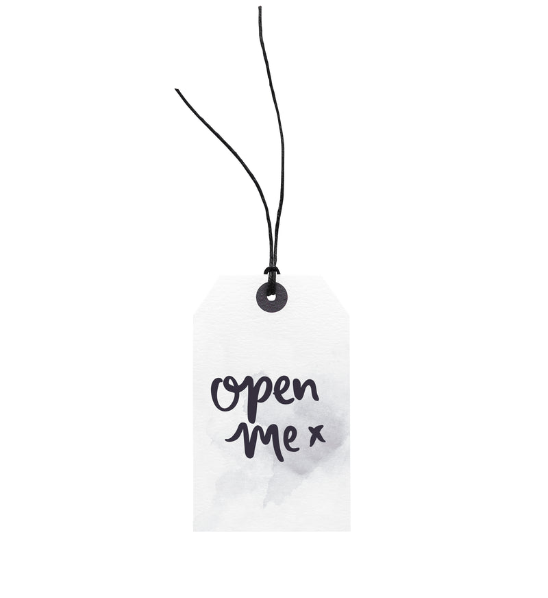 A luxurious Emma Kate Co Open Me // Gift Tag with European hemp twine, perfect to attach to your meaningful gift packages for a touch of elegance.