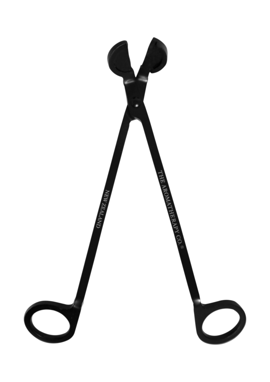 Black wick trimmer with its arms open, engraved The Aromatherapy Co and New Zealand