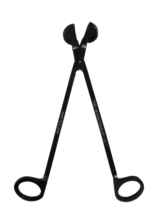 A pair of black Wick Trimmer scissors by The Aromatherapy Co, on a black background, a candle accessory.