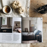 A Calm | Interiors to Nurture, Relax and Restore | Sally Denning book featuring a bed and a cup of coffee on a wooden table from Books.