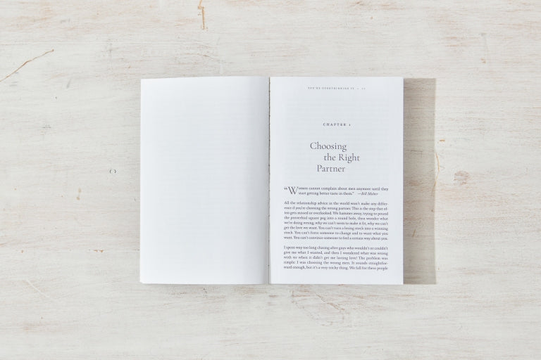 Book open to a spread on whitewashed timber