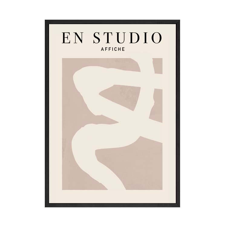 En Studio print in a black frame