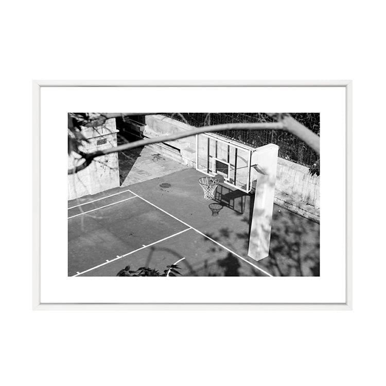 A black and white photo of a PAPIER HQ | BASKETBALL HOOP PRINT from Art Prints available for prints and delivery.