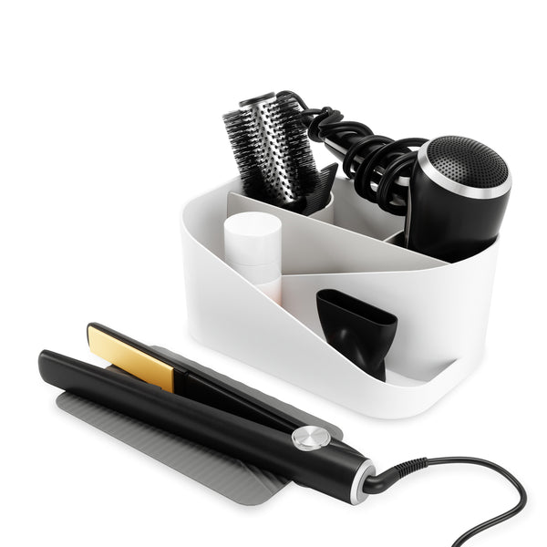 An Umbra GLAM HAIR TOOL ORGANIZER involving a hair comb and a hair dryer in a white container.
