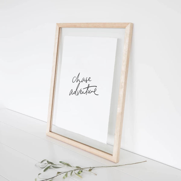 An AXEL & ASH eco-friendly framed Chase Adventure Print with the words 'change your life' on it.