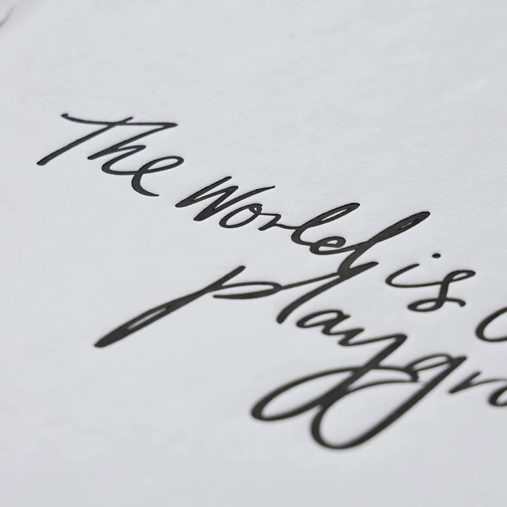 Close view of the handwritten World is Our Playground script
