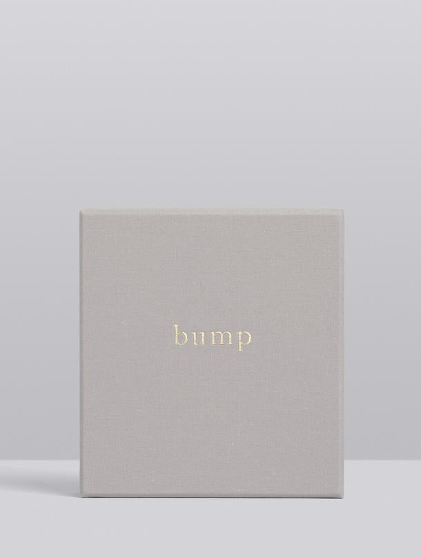 Light grey linen keepsake box for the Bump pregnancy journal against a soft grey backdrop