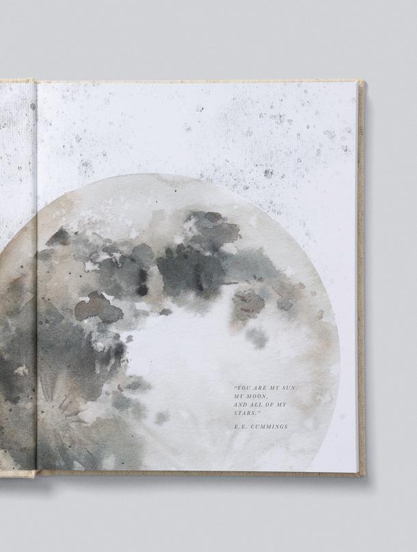 Open Write To Me baby journal showing a watercolour moon illustration with an E.E. Cummings quote