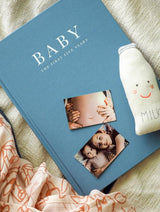 A Write To Me Baby Journal - Birth To Five Years - Grey / Oatmeal / Pink / Blue with photos and a bottle of milk.